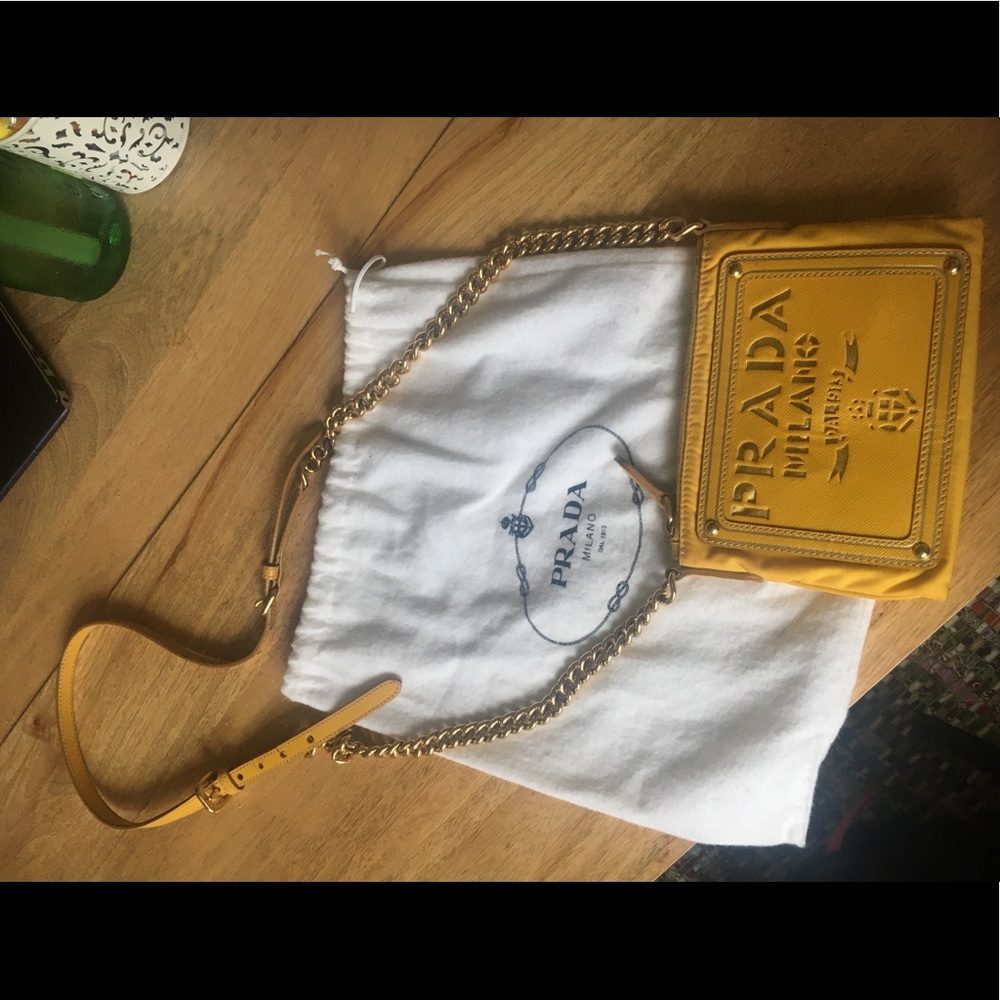 Bright yellow Prada crossbody wallet purse